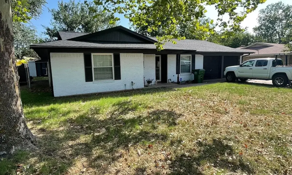 Professional roofing crew working on a residential roof in LaBelle